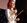 Carrie Grant speaking on stage with a microphone